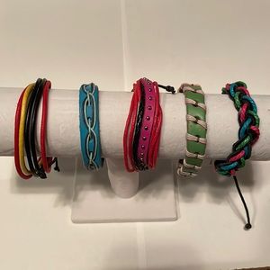 Five NWOT adjustable leather and cord bracelets